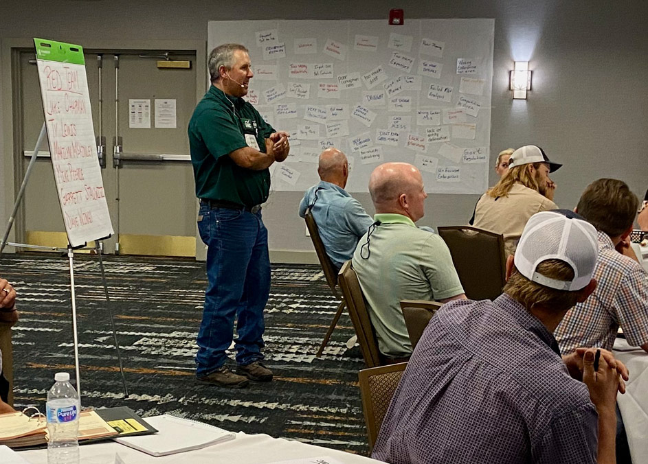 Instructor taking questions during lecture at Ranching for Profit School