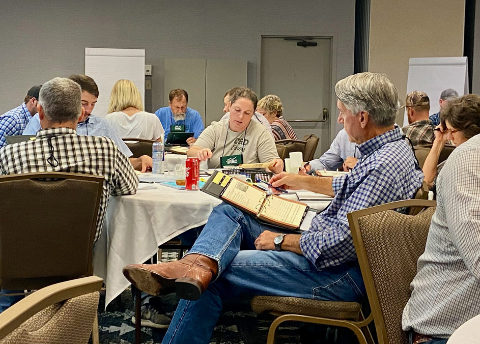 Students working in workbooks at the Ranching for Profit School